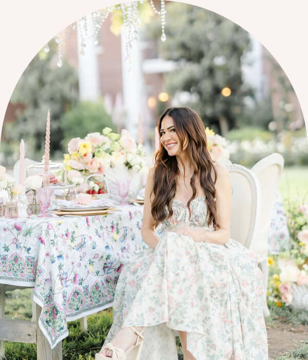 Gracie Poulson at a table set with roses